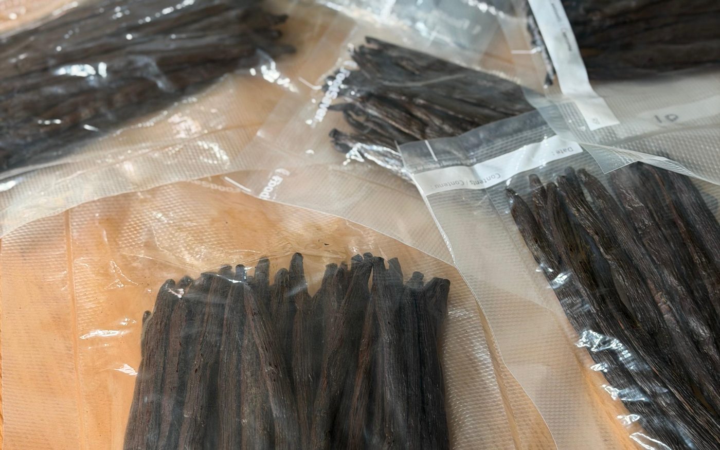 Graded vanilla pods vacuum-sealed in small batches in the UK